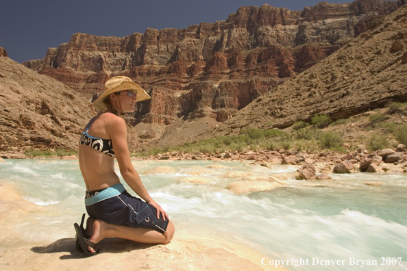 Woman sitting along side the Little Colorado River.  Grand Canyon.