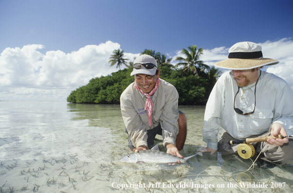 Guide and angler releasing nice bonefish