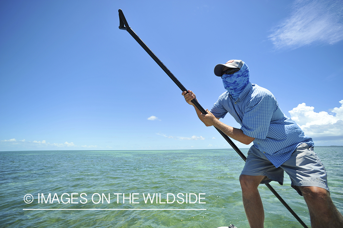 Flats guide poling flats in Florida Keys.