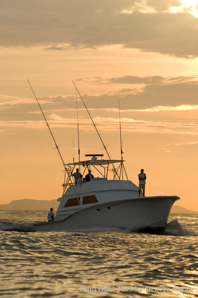 Deep sea fishing charter boat on ocean.