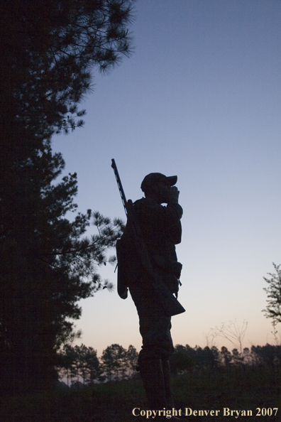 Turkey hunter calling in the field