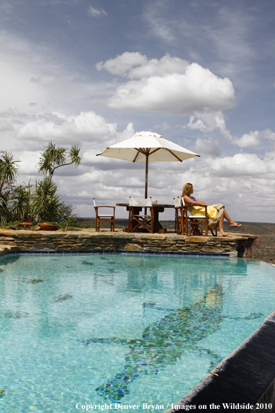 Woman by infinity pool