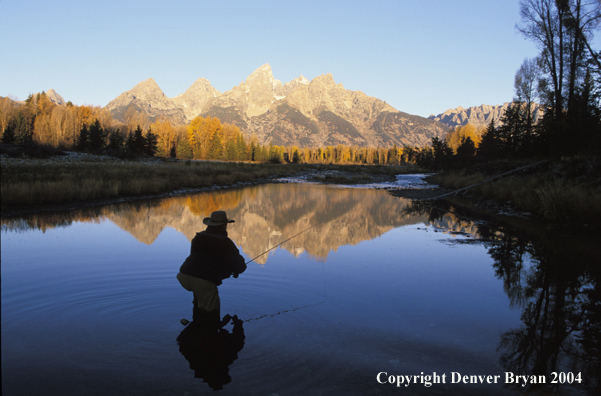 Flyfisherman casting on river.