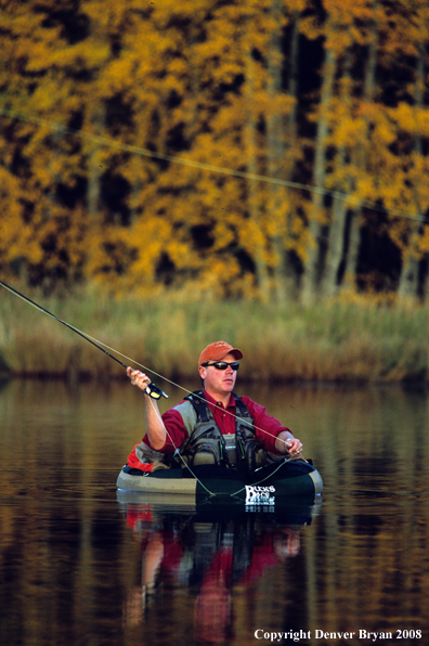 Flyfisherman casting on river.