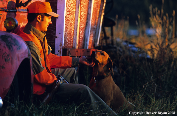 Upland game bird hunter with dog