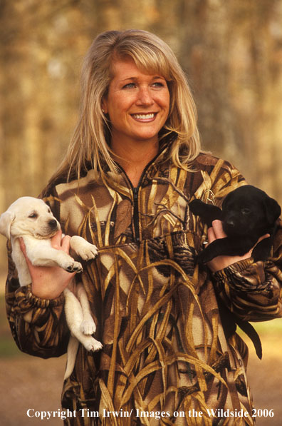 Woman hunter with puppies.