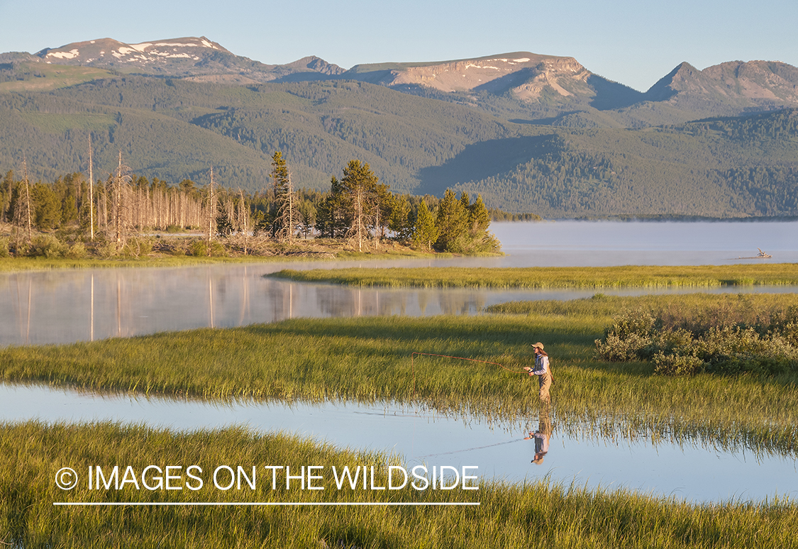 Flyfishing woman on Hebgen Lake, Montana.