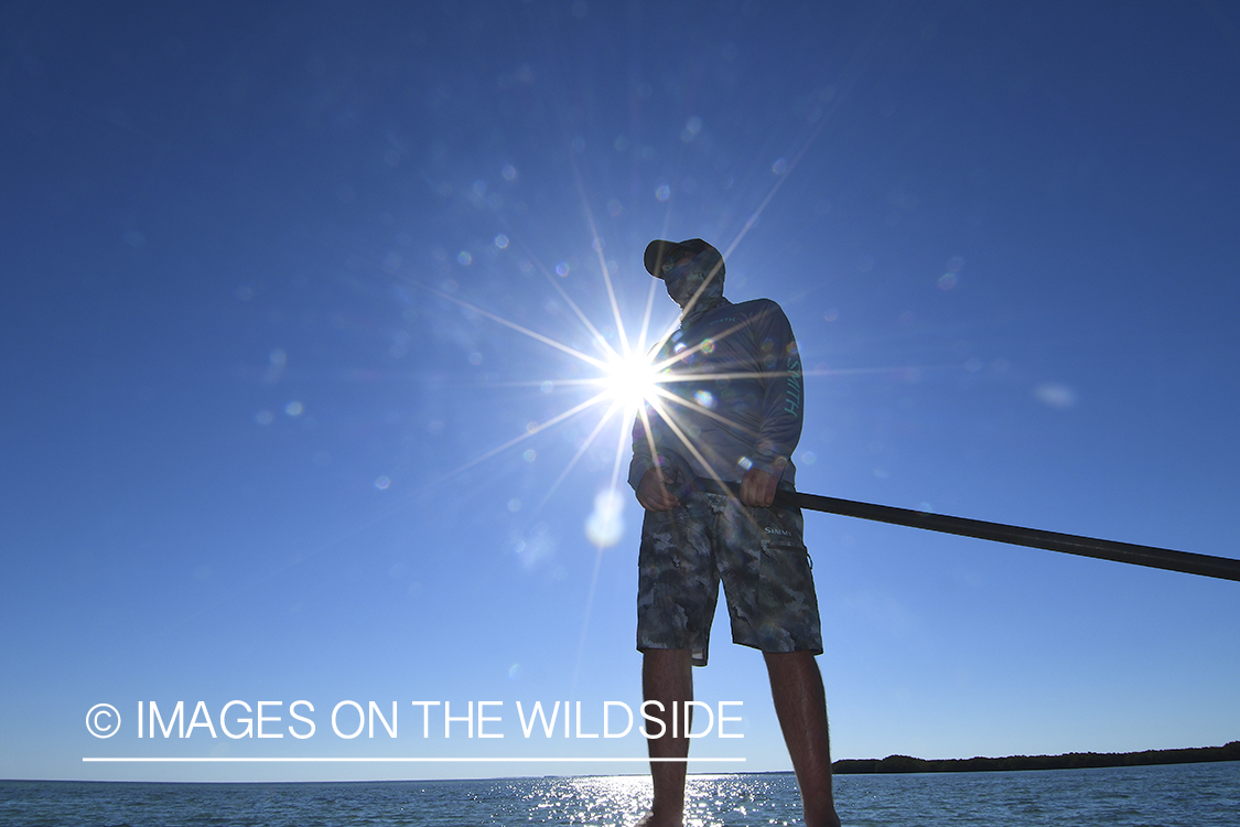 Flats guide poling flats in Florida Keys.