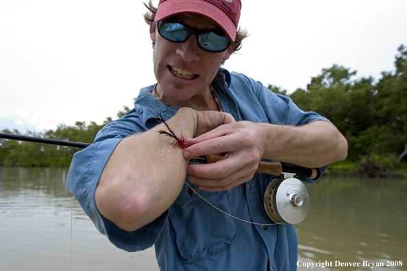 Flyfisherman w/fly on his arm