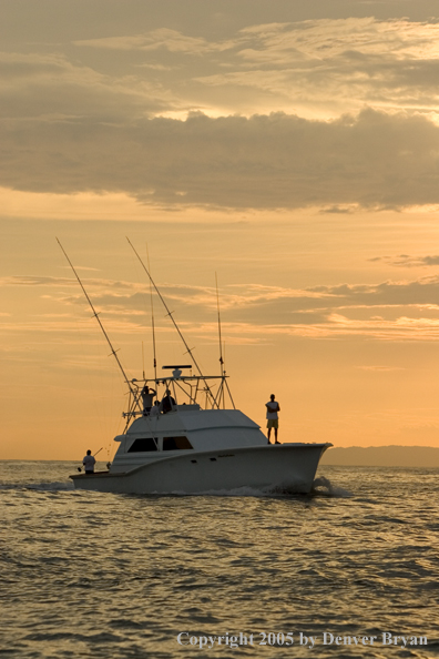 Deep sea fishing charter boat on ocean.