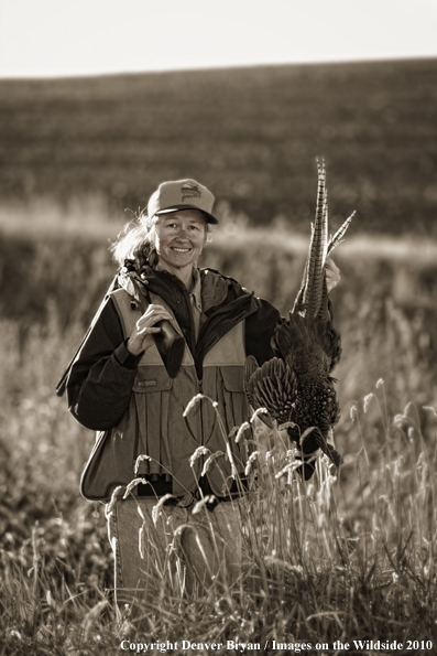 Upland game bird hunter with bagged pheasant. (Original image #11002-081.16)