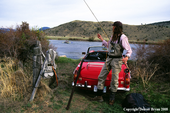 Flyfisherwoman preparing to fish