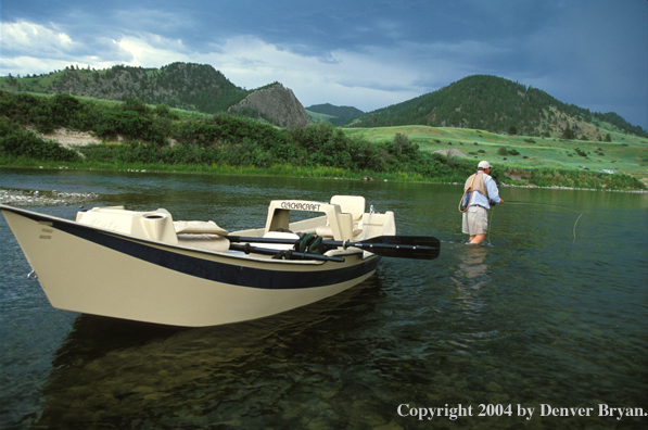 Flyfisherman casting on river.