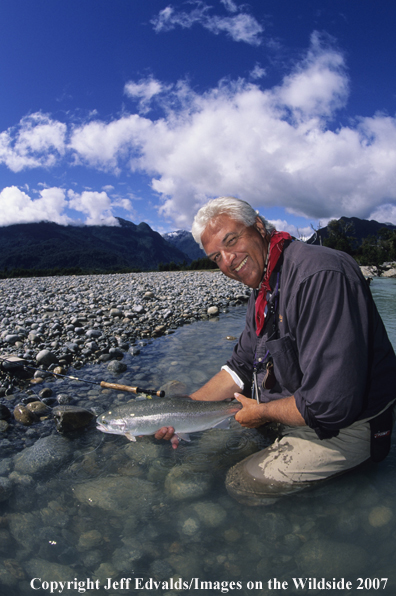 Flyfisherman with a nice Rainbow Trout