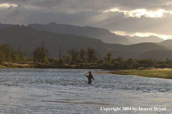 Flyfisherman casting in river.