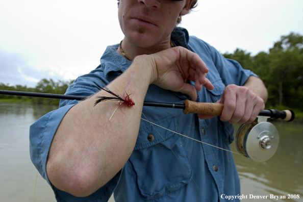 Flyfisherman w/hook on his arm