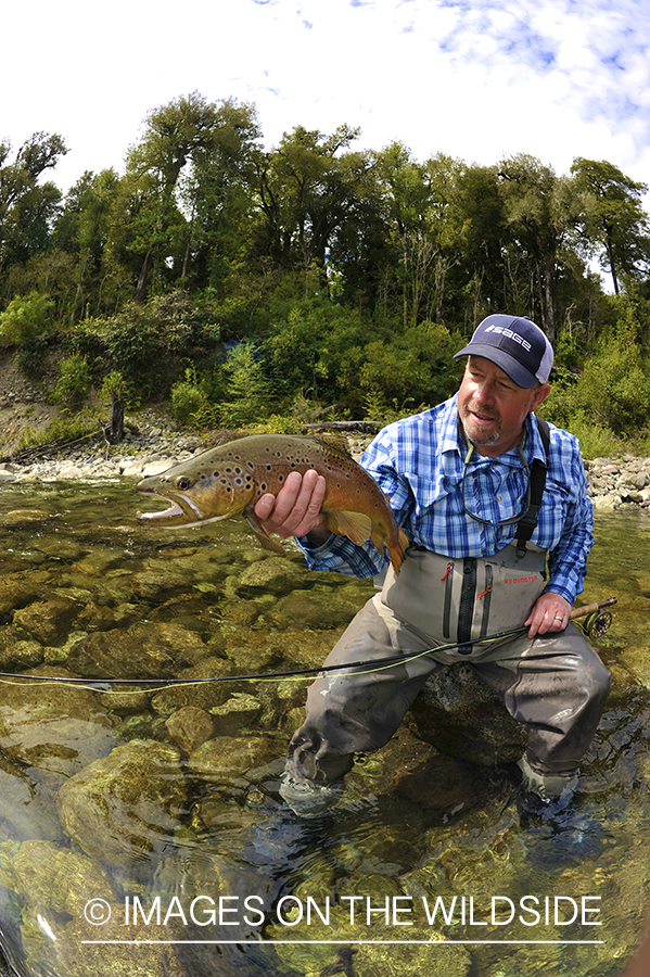 Fisherman with brown trout.