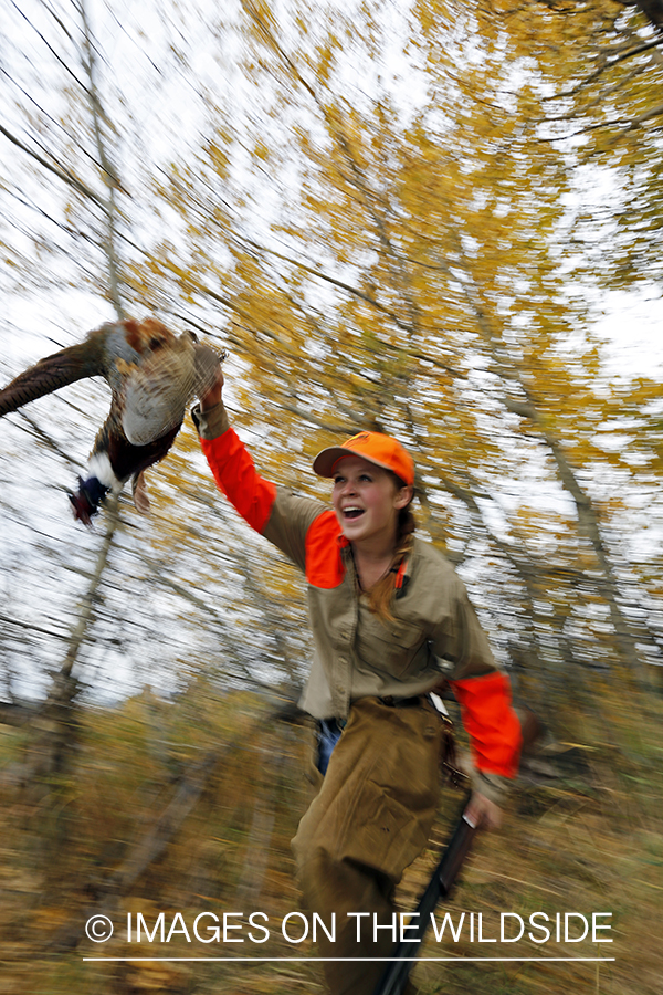 Woman with bagged pheasant.