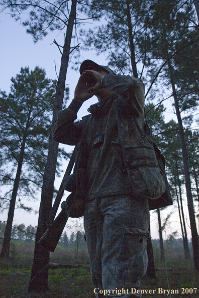 Turkey hunter calling in the field