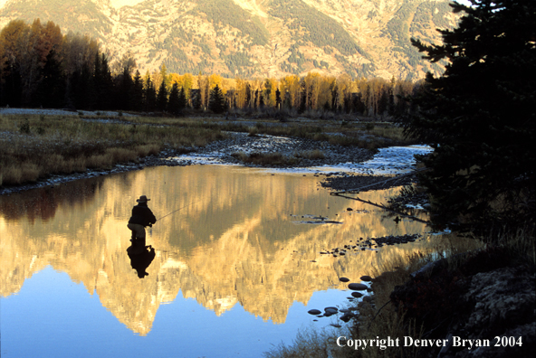 Flyfisherman casting on river.