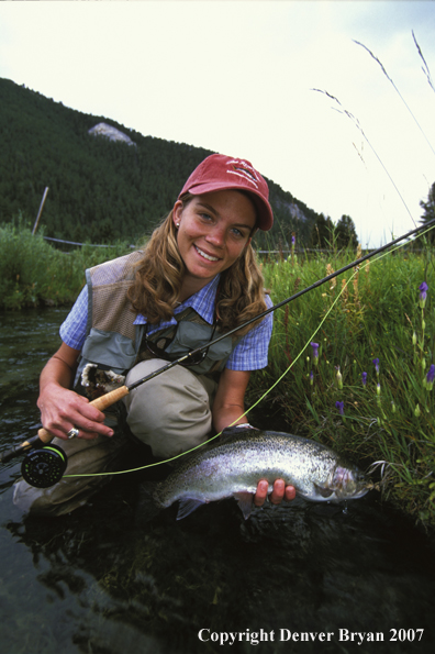 Flyfisher with rainbow trout.