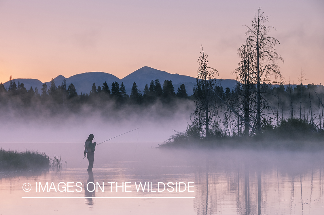 Flyfishing woman on Hebgen Lake, Montana.