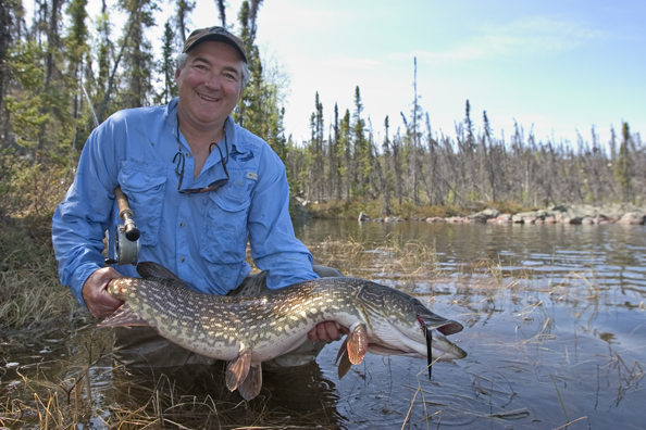 Flyfisherman with Northern pike (MR)