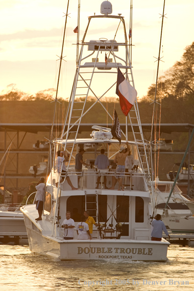 Deep sea fishing charter boat in marina.