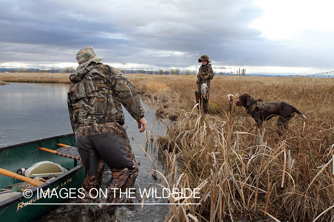 Father and son waterfowl hunting.