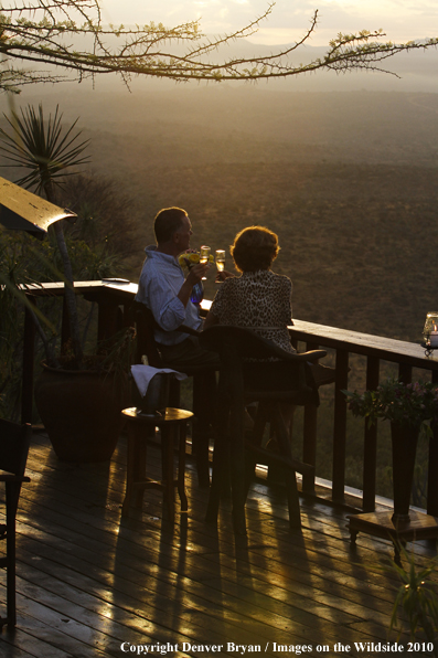 Couple watching sunset on safari