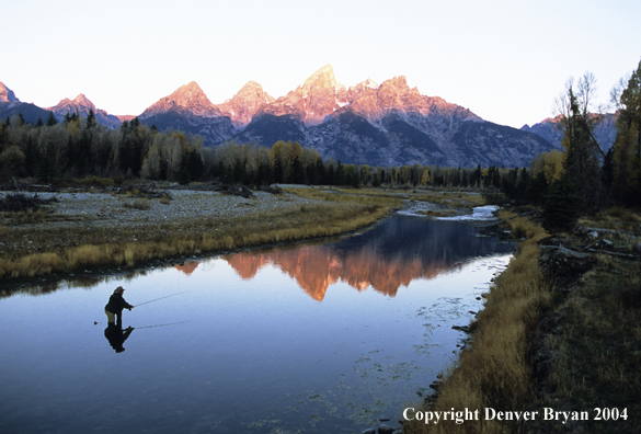 Flyfisherman casting on river.