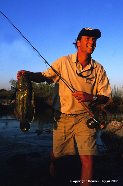 Flyfisherman with tigerfish catch