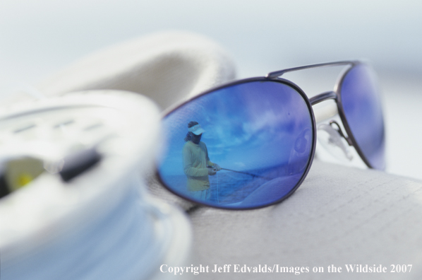 Reflection of angler in sunglasses