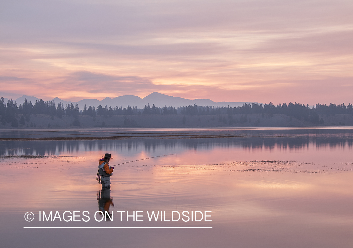 Flyfishing woman on Hebgen Lake, Montana.