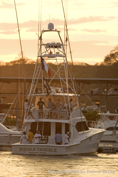 Deep sea fishing charter boat in marina.