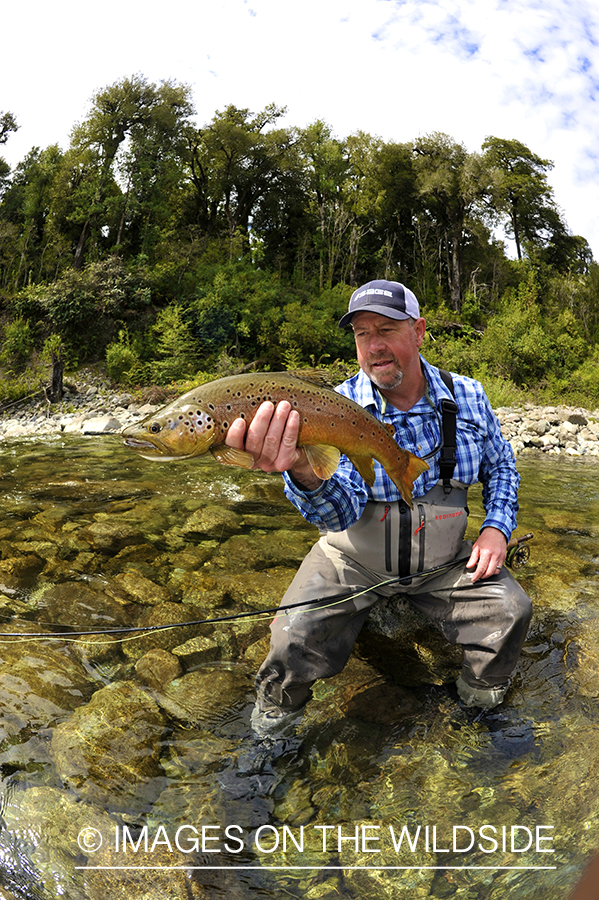 Fisherman with brown trout.