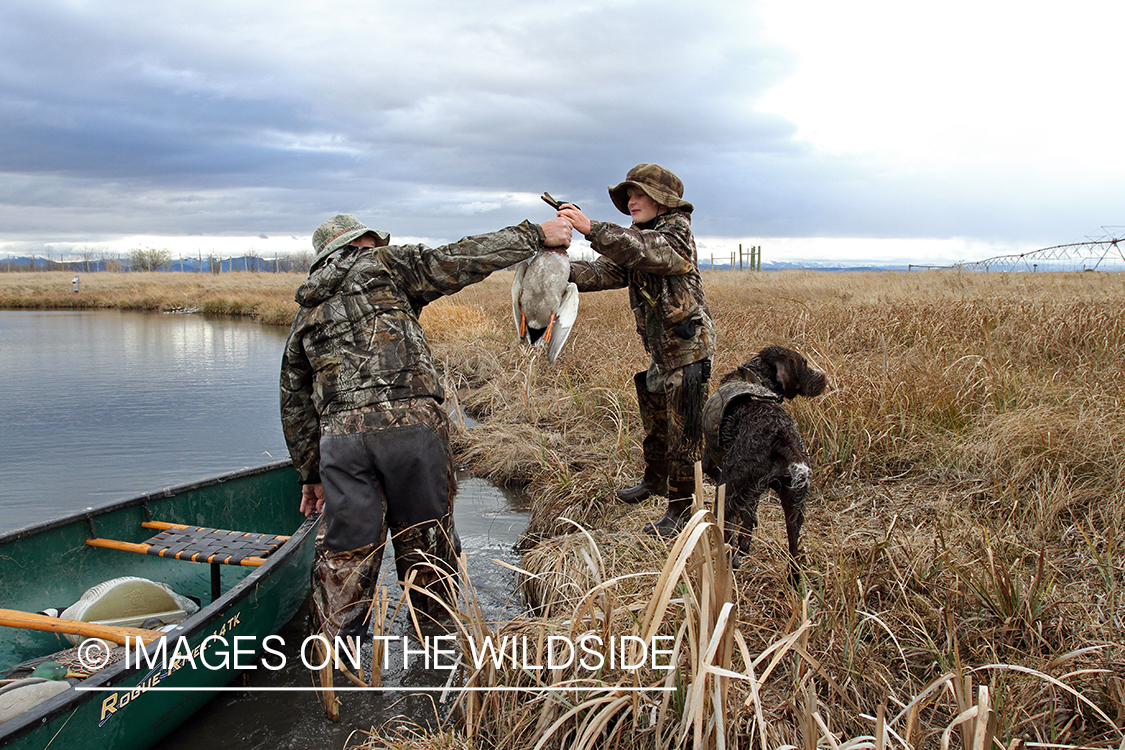 Father and son waterfowl hunting.