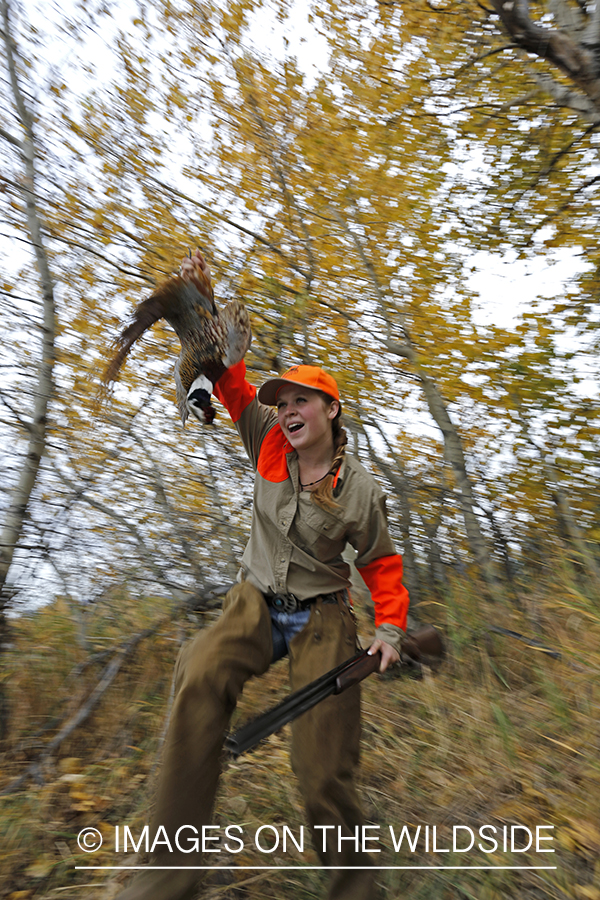 Woman with bagged pheasant.