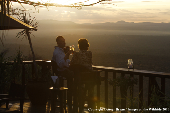 Couple watching sunset on safari