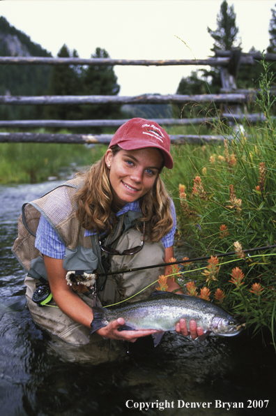 Flyfisher with rainbow trout.