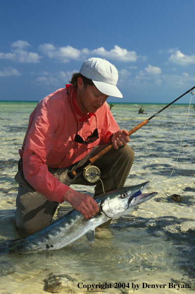 Saltwater flyfisherman with barracuda.