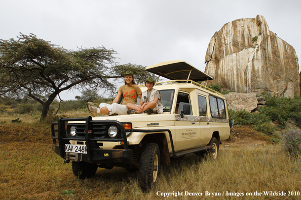 Kids on landrover on african safari