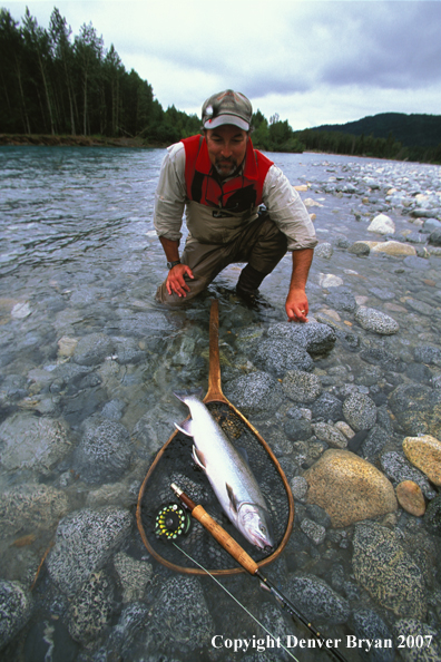 Flyfisherman with rainbow trout.