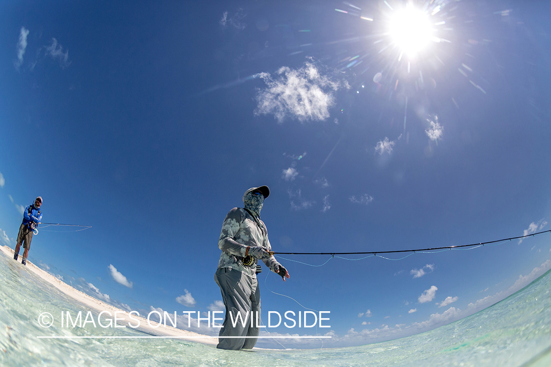 Flyfisherman on St. Brandon's Atoll flats, Indian Ocean.