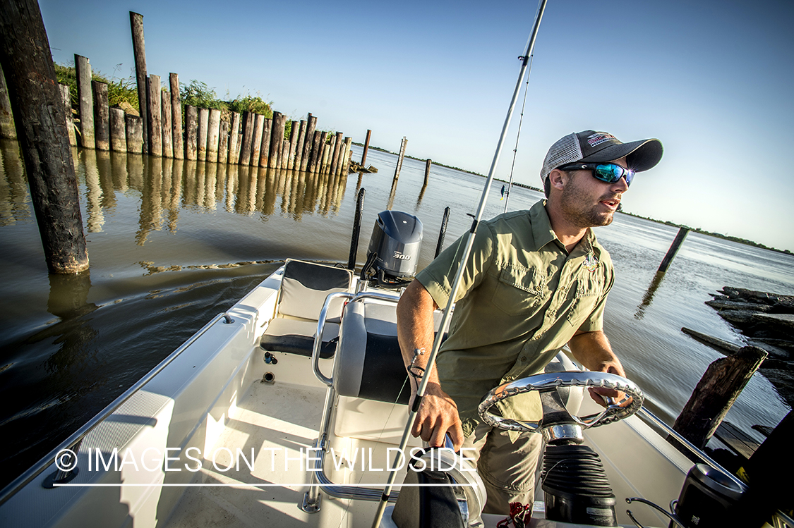 Fisherman on boat at the docks.