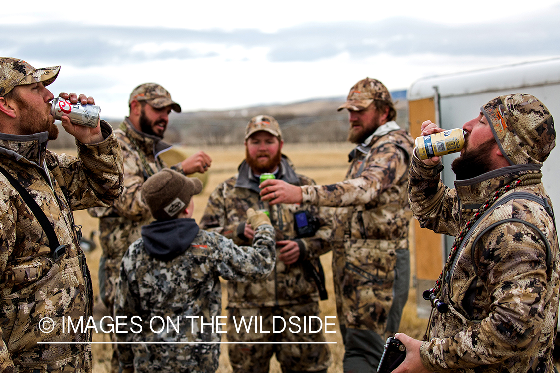 Hunters celebrating after hunting.