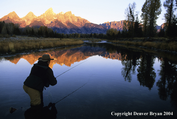 Flyfisherman casting on river.