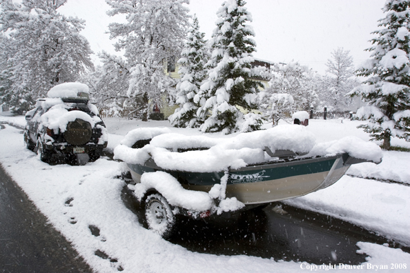 Driftboat covered in snow