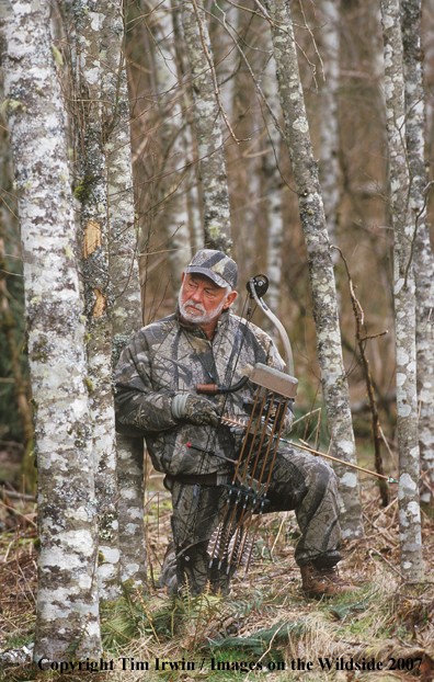 Bowhunter watching target.