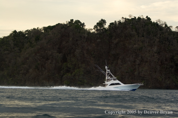 Deep sea fishing charter boat on ocean.